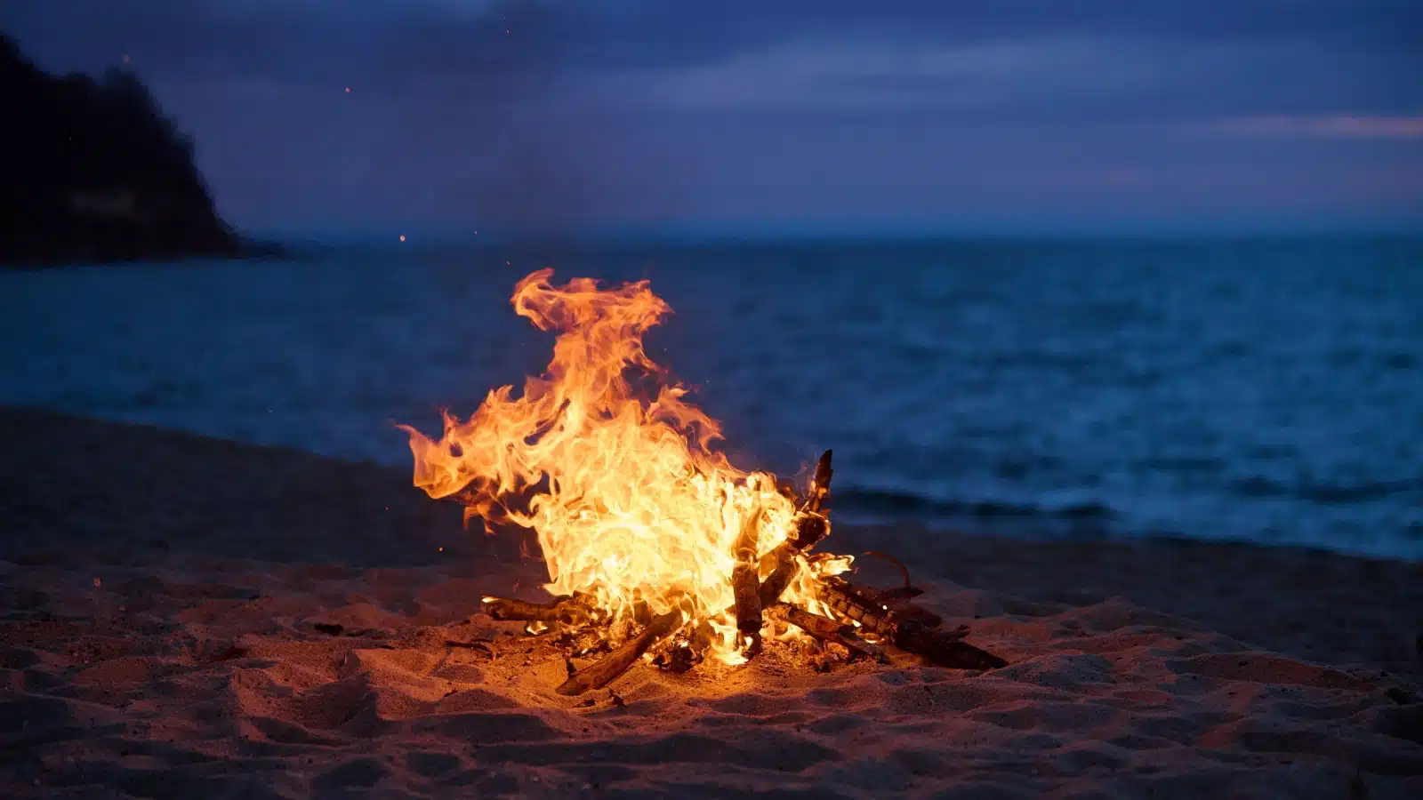 A bonfire at a beach.