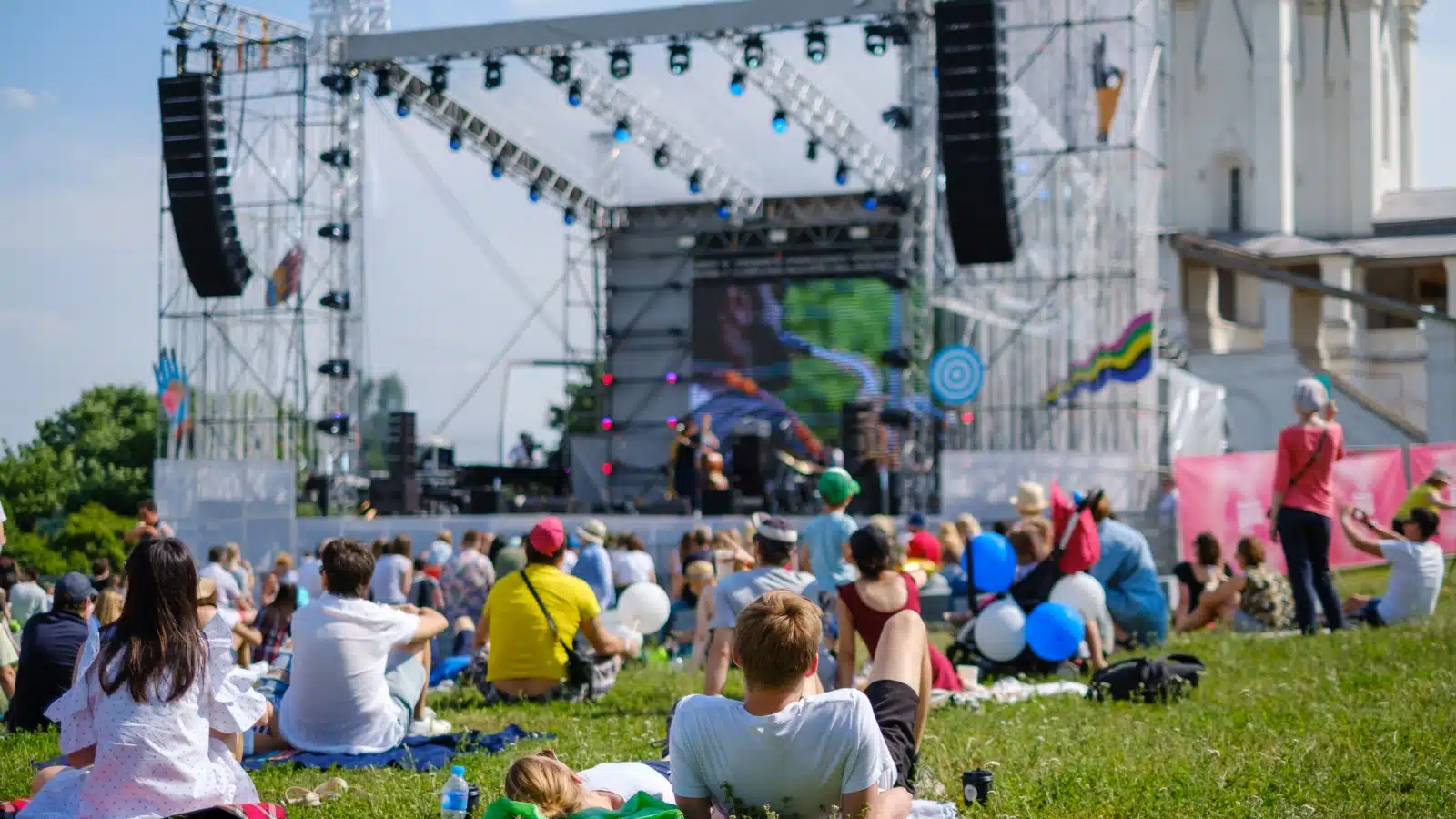 People enjoying an outdoor concert in a park.