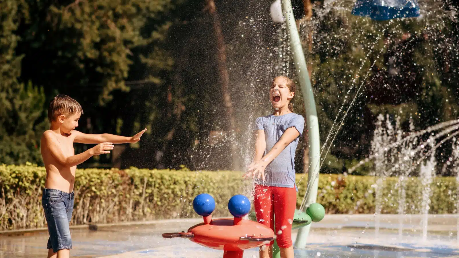Kids playing at a splash pad.