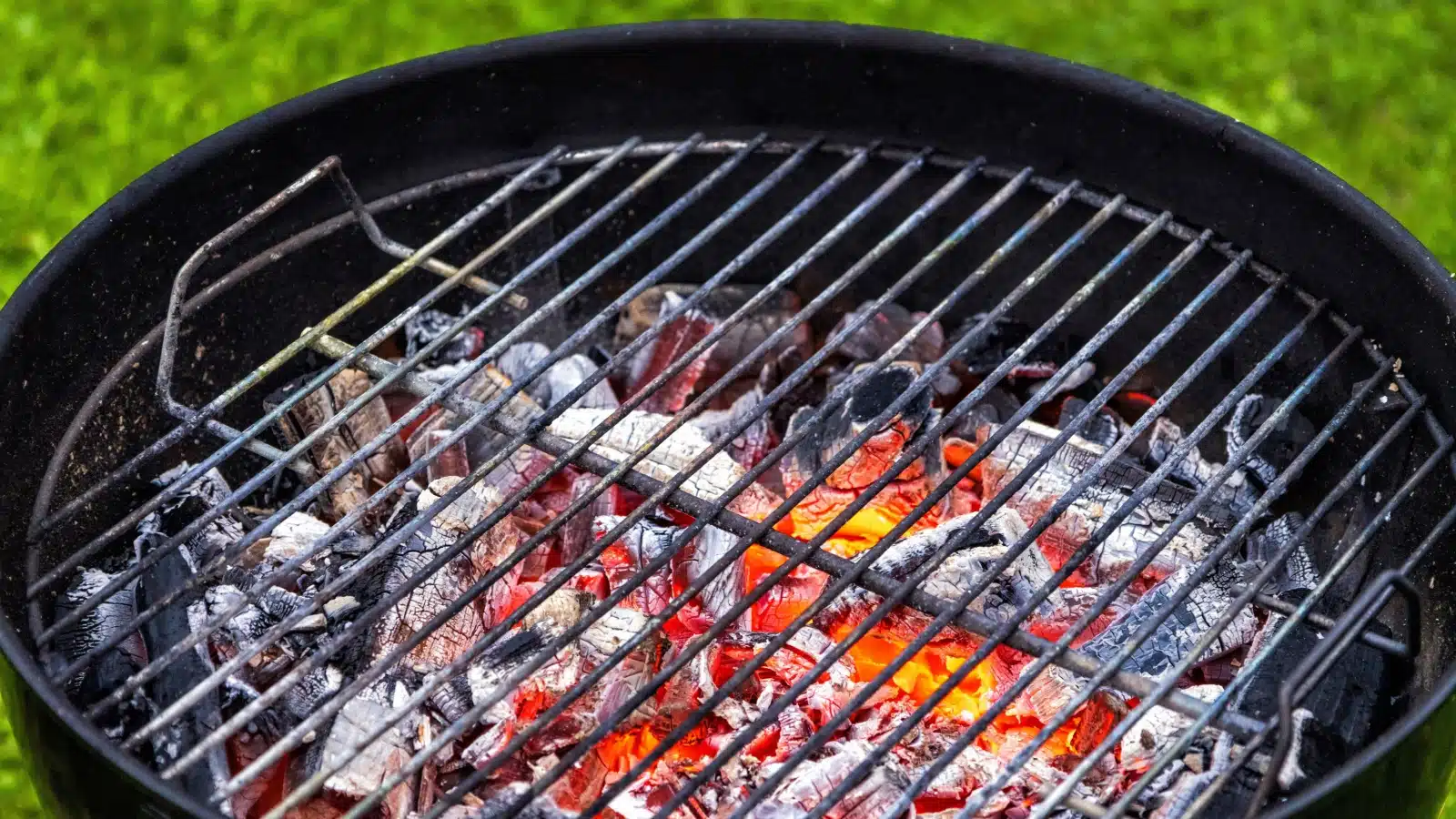 red hot charcoal embers on a grill.