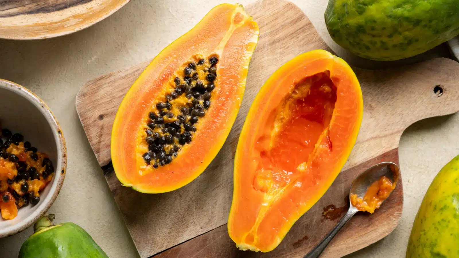 Freshly cut papaya on a cutting board.