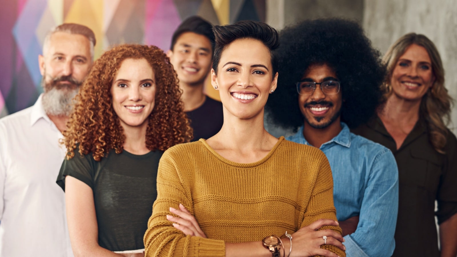 A group of happy, smiling, confident looking people.