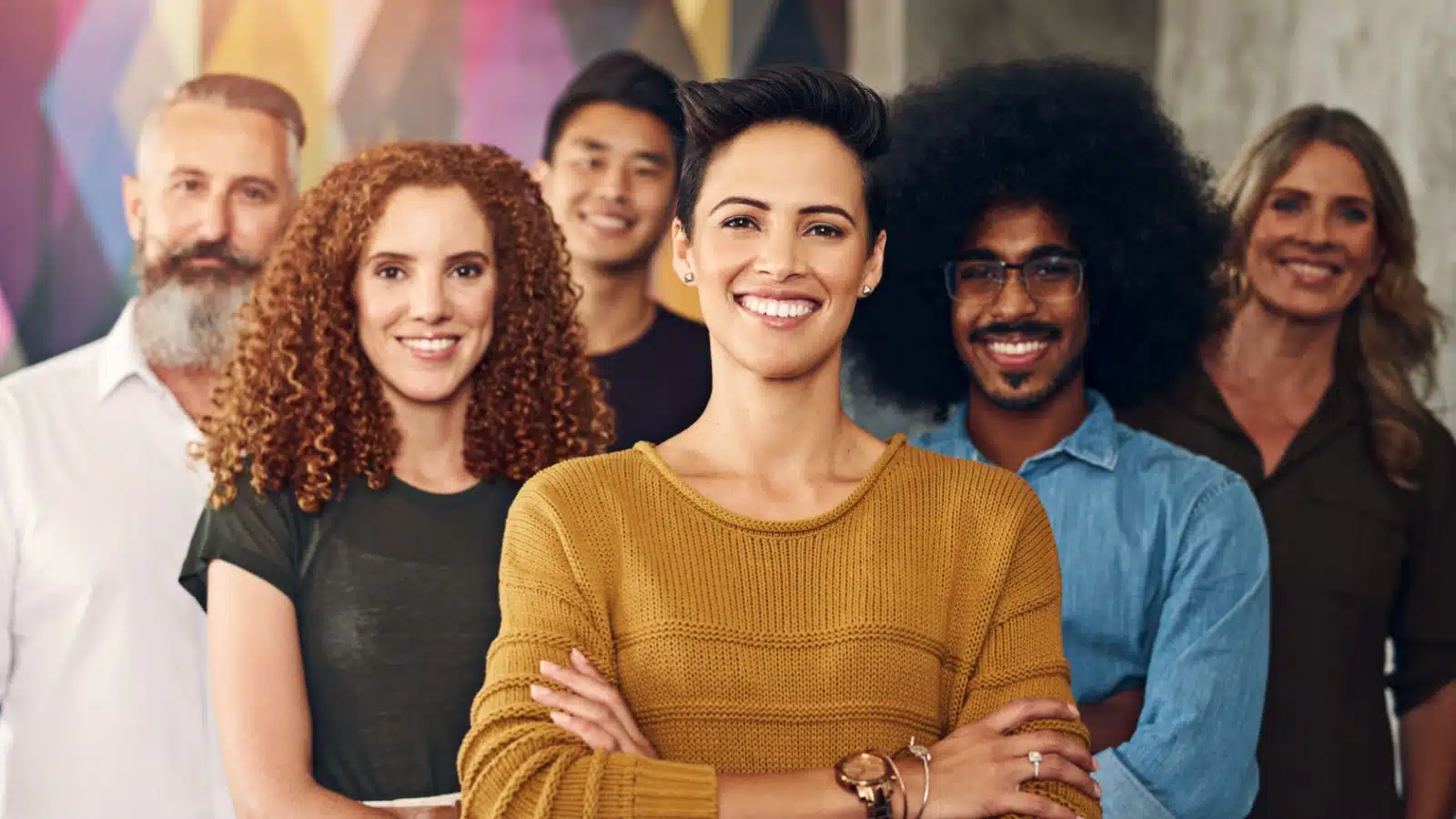 A group of happy, smiling, confident looking people.