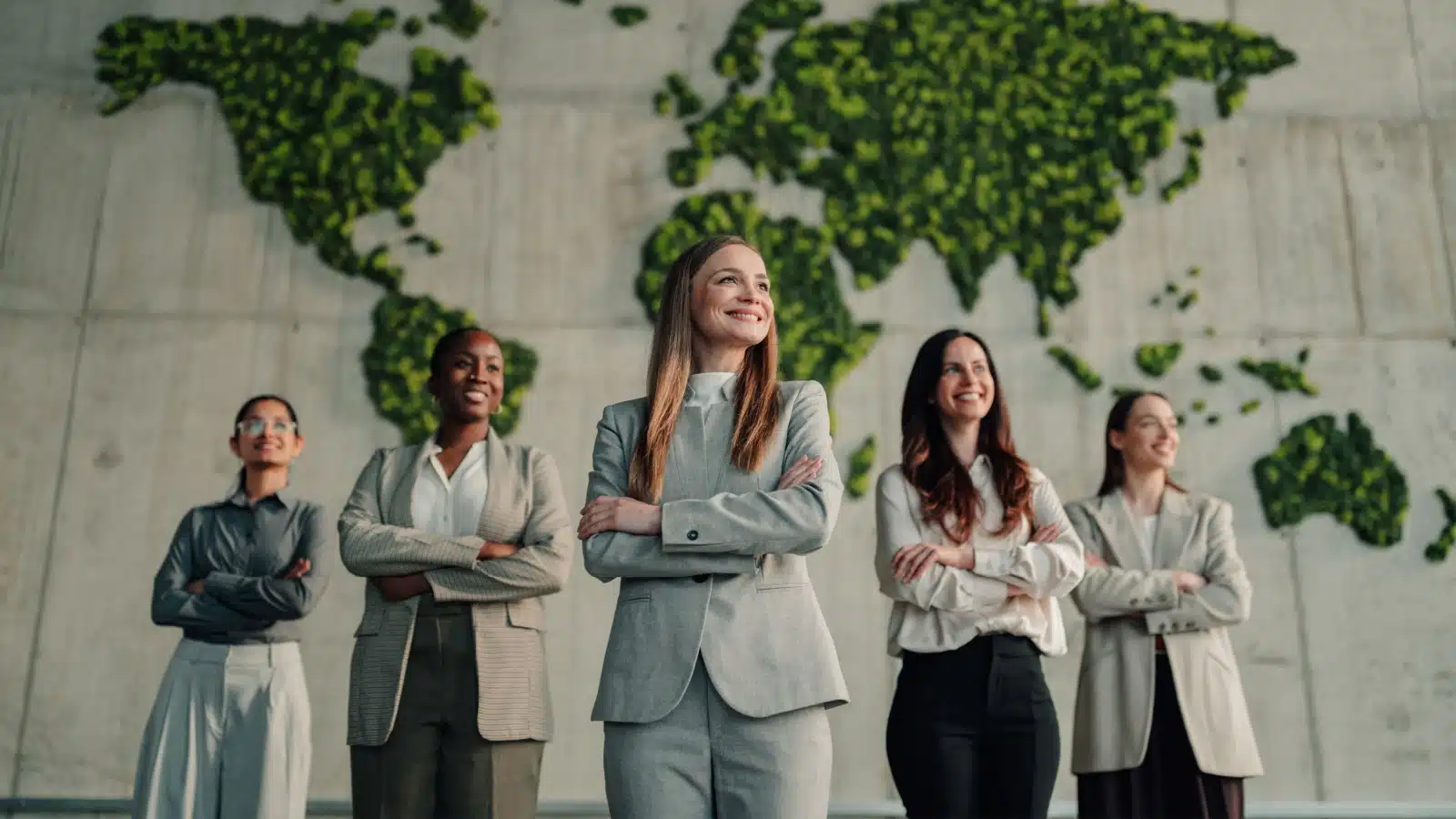 A group of self-assured businesswomen standing proudly outside represents how to be confident.