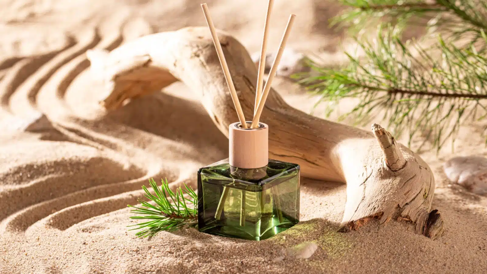 A scented oil diffuser on the beach to represent summer smells.
