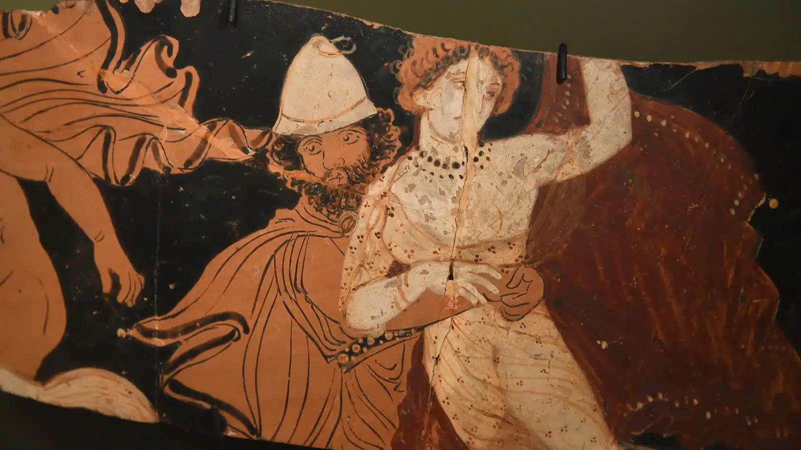 An ancient pottery shard featuring Hades & Persephone.